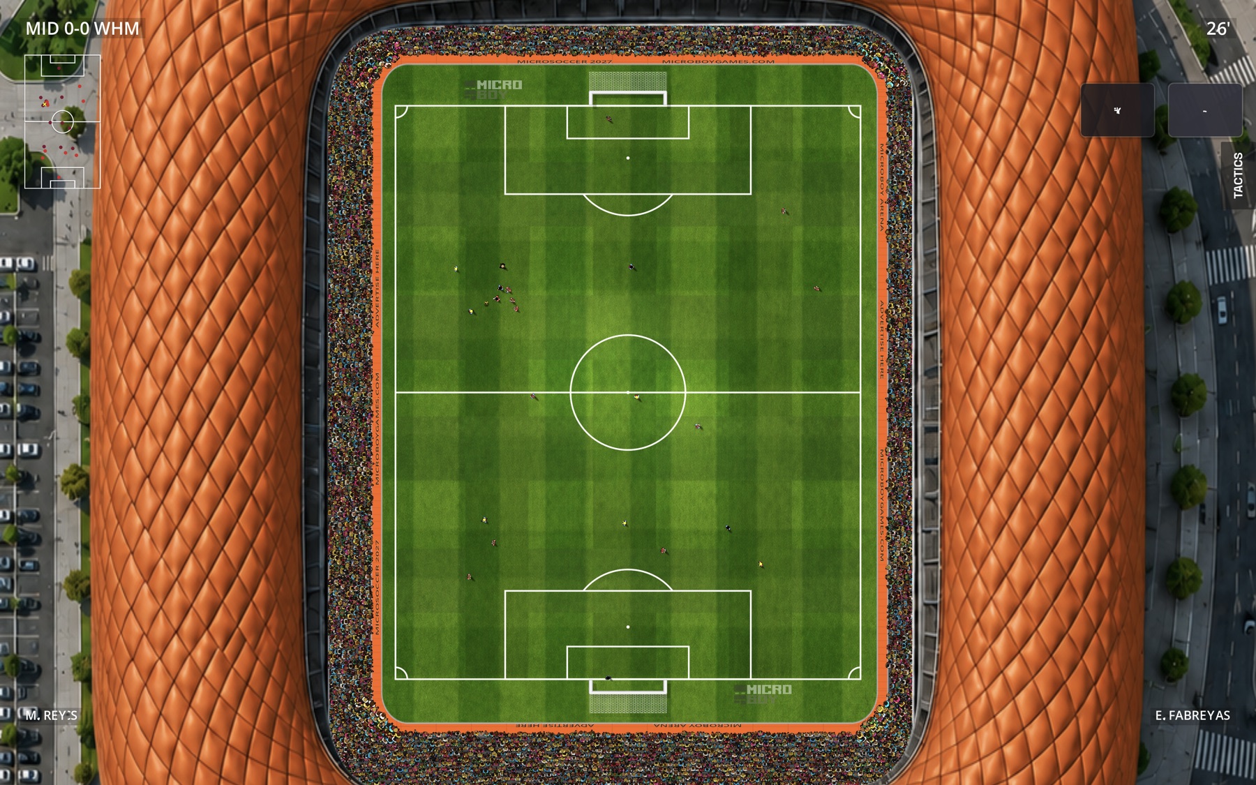 Orange stadium and full MicroSoccer pitch during a match